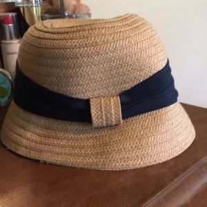 Straw bucket sun hat with navy ribbon
